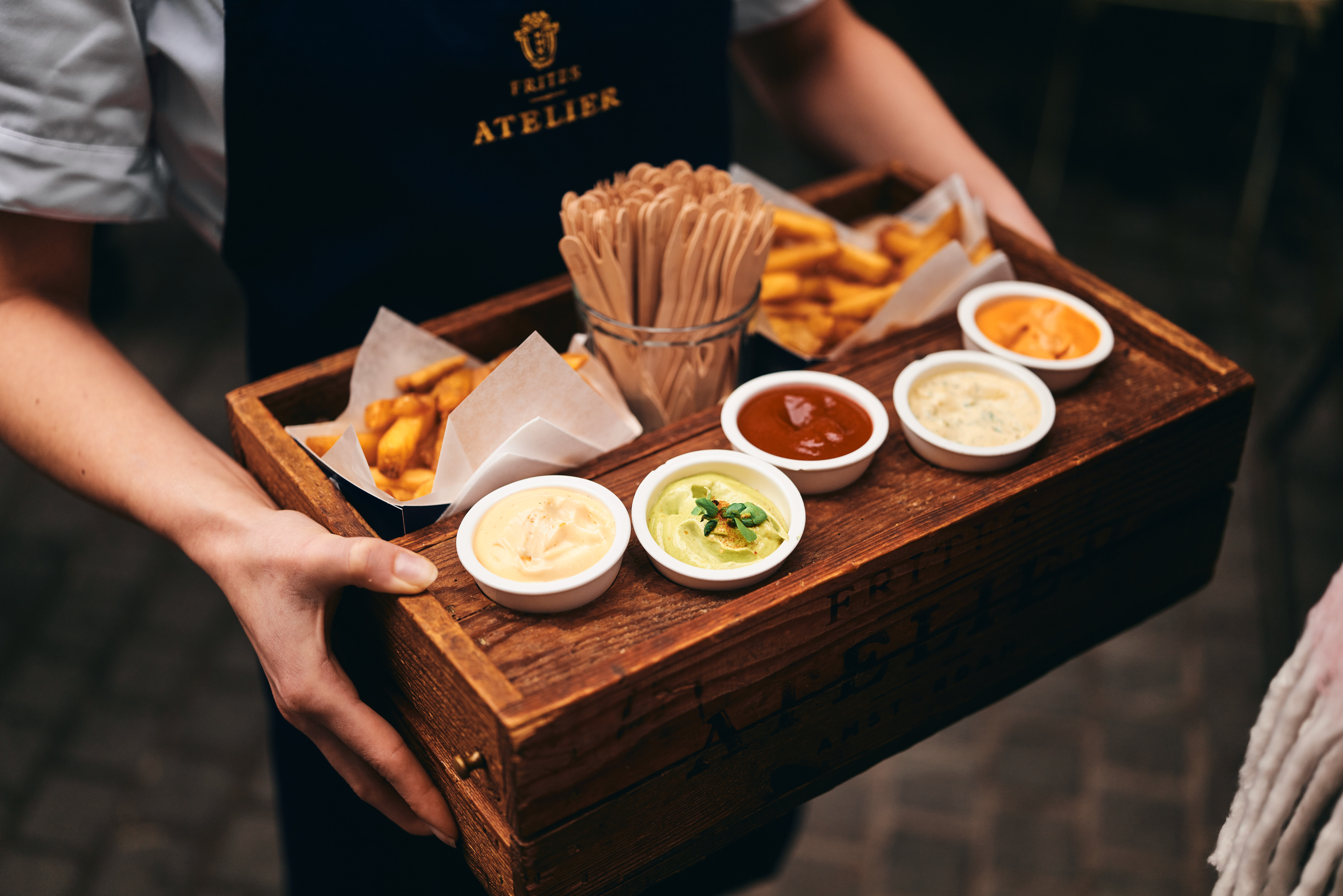 Frites Atelier sauces arranged together with Frites.